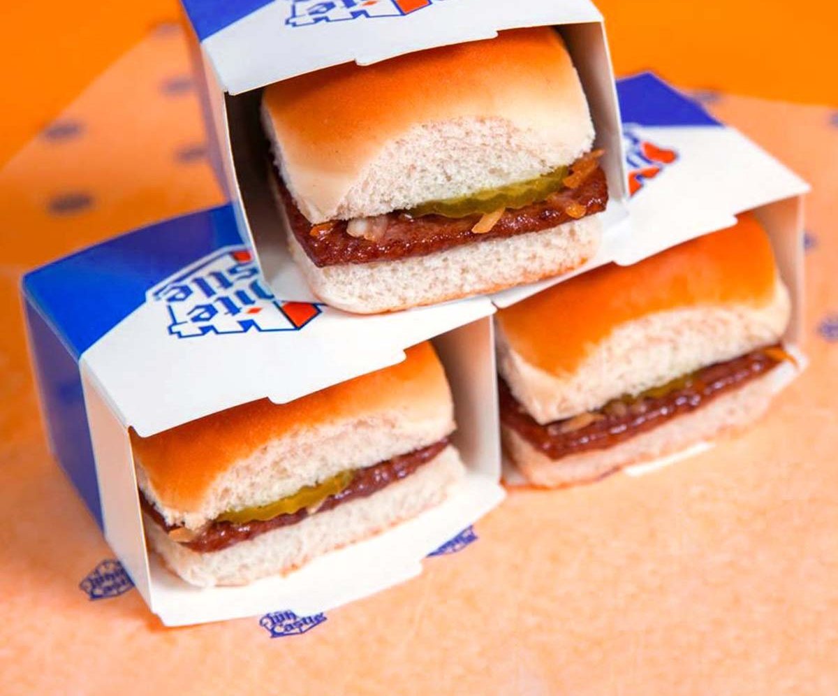 Three printed burger clamshell sleeves loaded with sliders