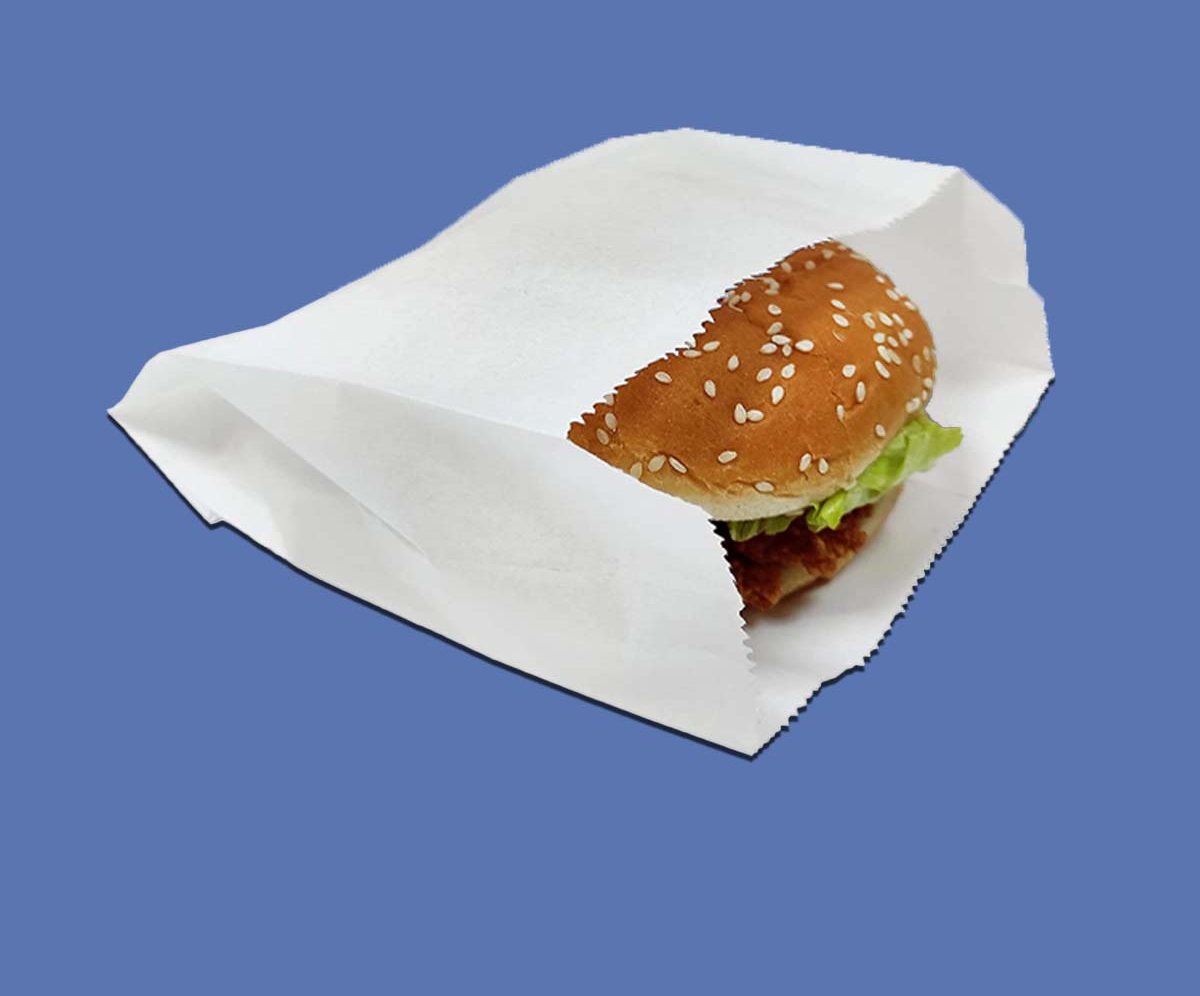 White greaseproof burger sleeve folded around a sesame bun