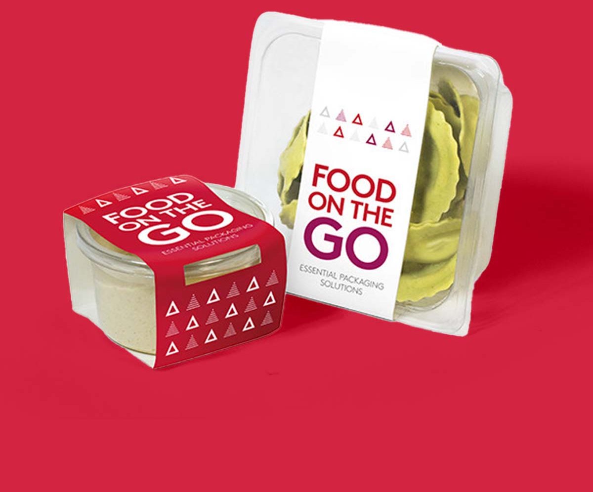 Printed food-to-go sleeves wrapped around a salad pot and a snack box
