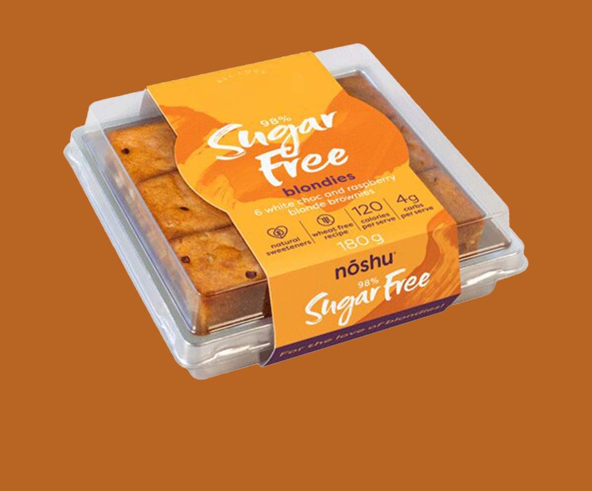 Clear snack tray banded with an orange printed retail sleeve