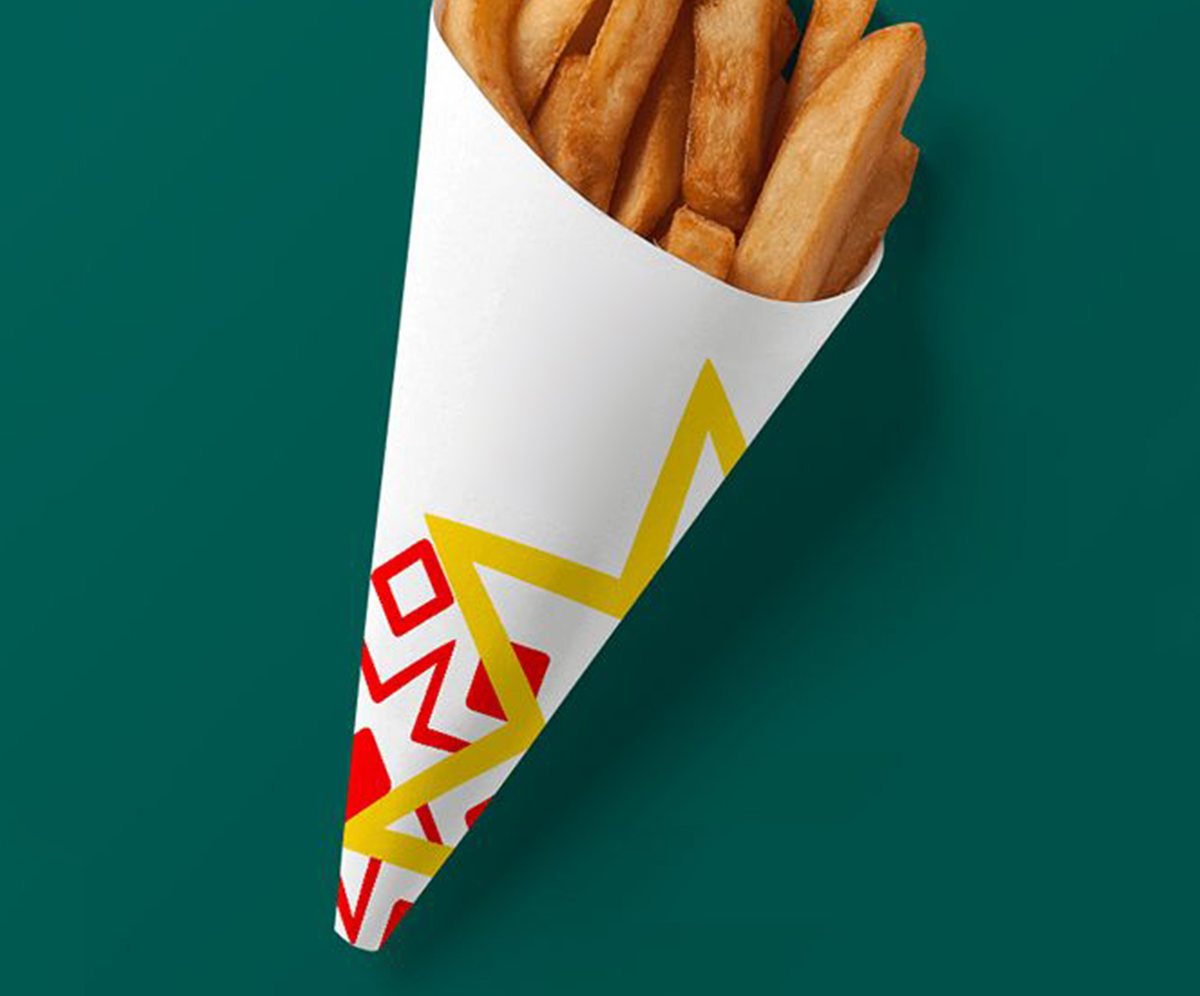 White fry cone printed with a red and yellow zigzag pattern