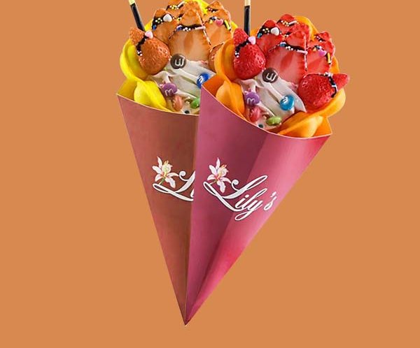 Two loaded crepe cones in printed magenta and red sleeves