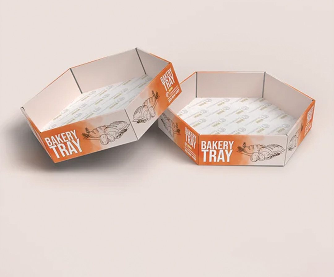 Two printed bakery trays in orange and white, shown empty