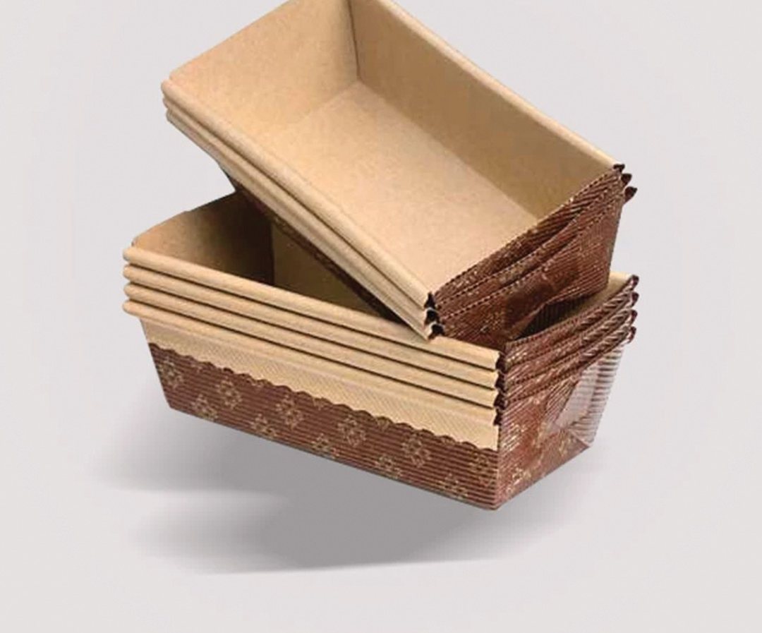 Stack of kraft bakery trays with one lifted clear of the pile