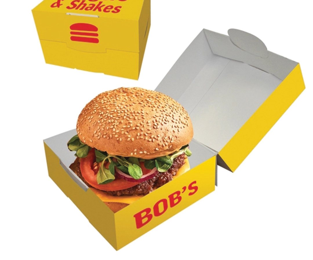 Yellow printed burger tray branded for a diner, holding a burger