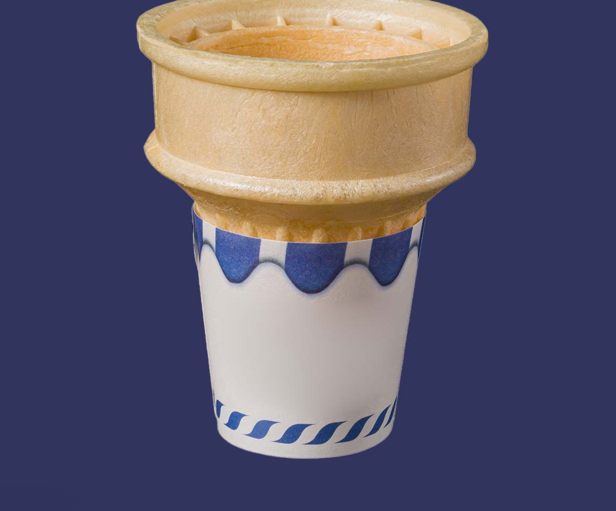 Cake cone sleeve printed in a flat spot color with a scalloped border