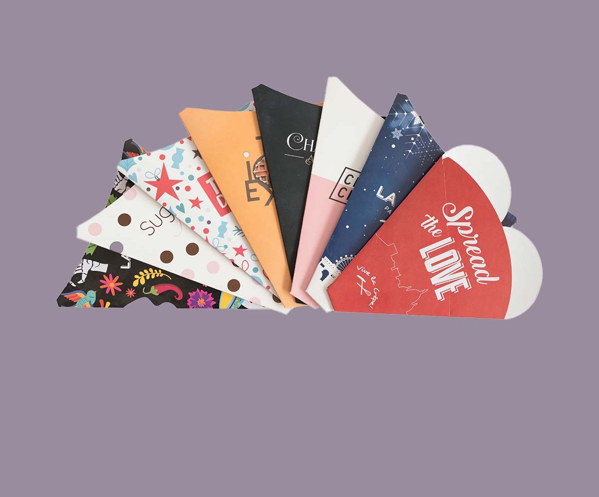 A spread of cardboard cone sleeves showing eight different printed designs