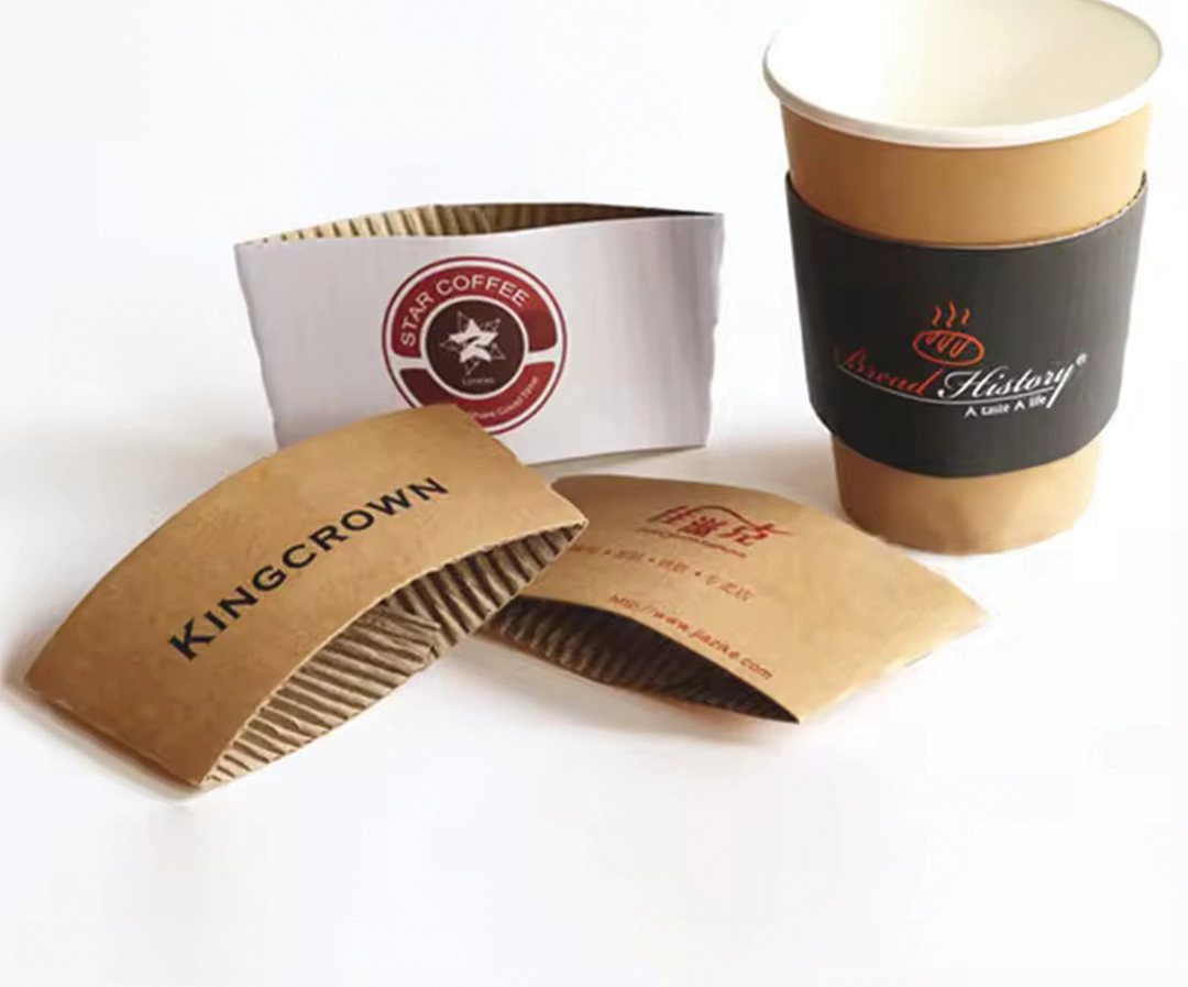 Kraft drink sleeves printed with a crown logo beside two cups