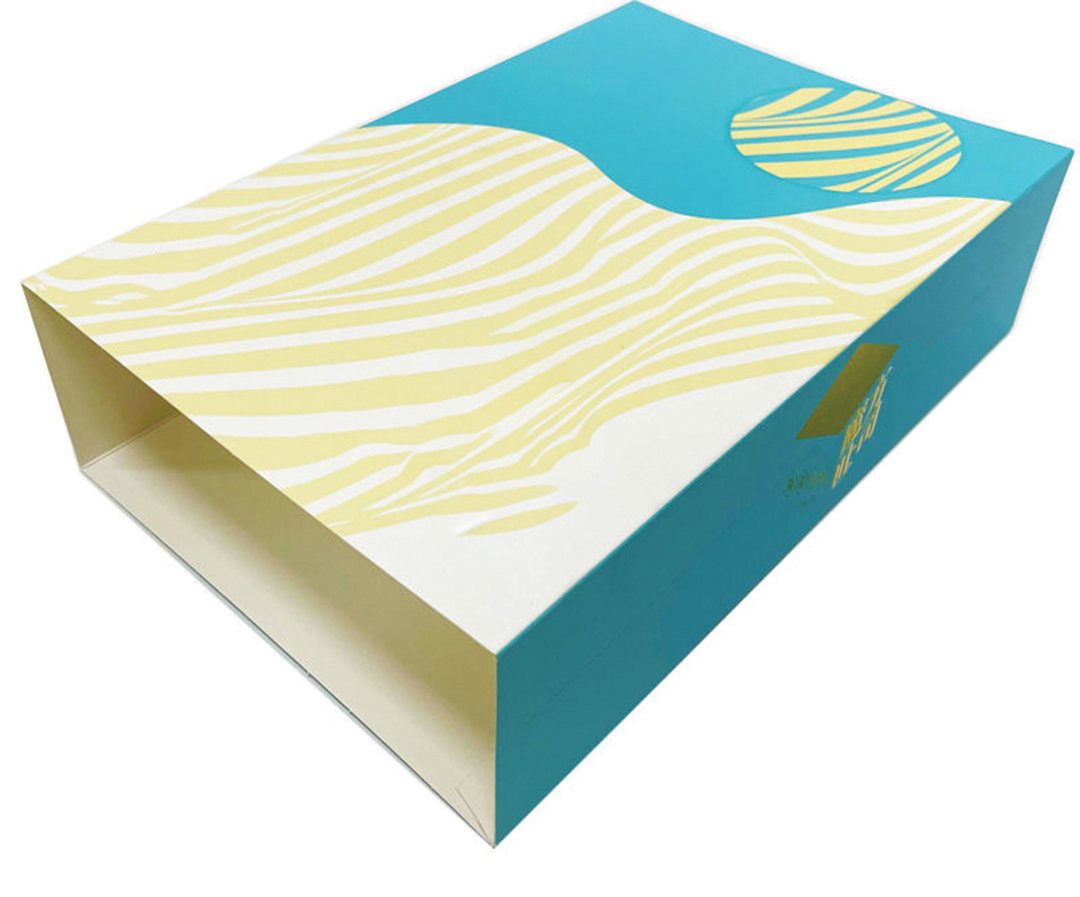 Teal and yellow printed dessert sleeve box shown closed