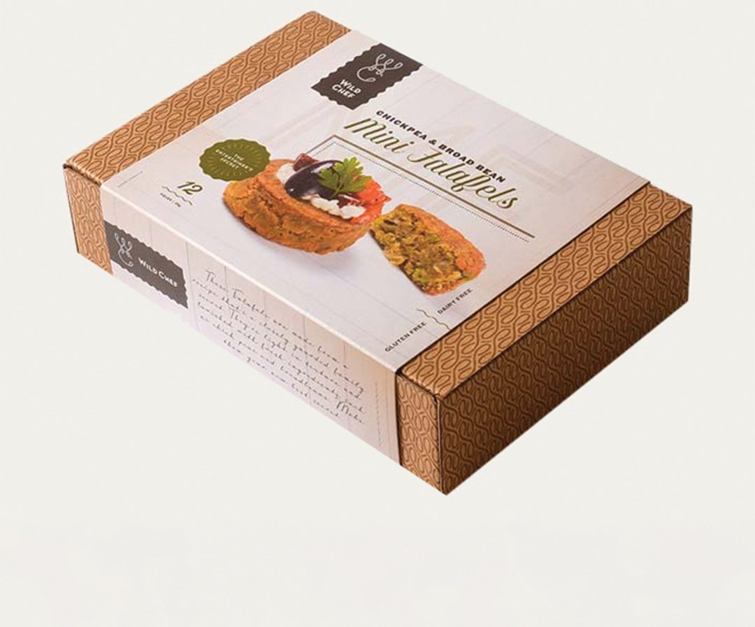 Kraft dessert sleeve wrapped around a boxed patisserie selection