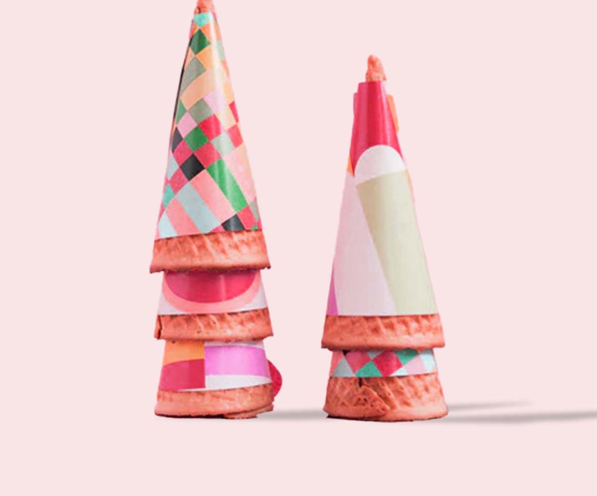 Patterned cone sleeves stacked on a pale pink backdrop