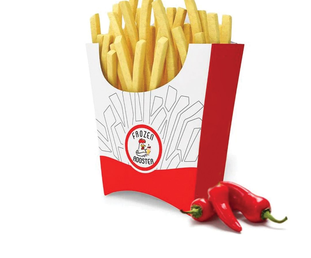 White and red printed fries scoop filled with fries beside chilies
