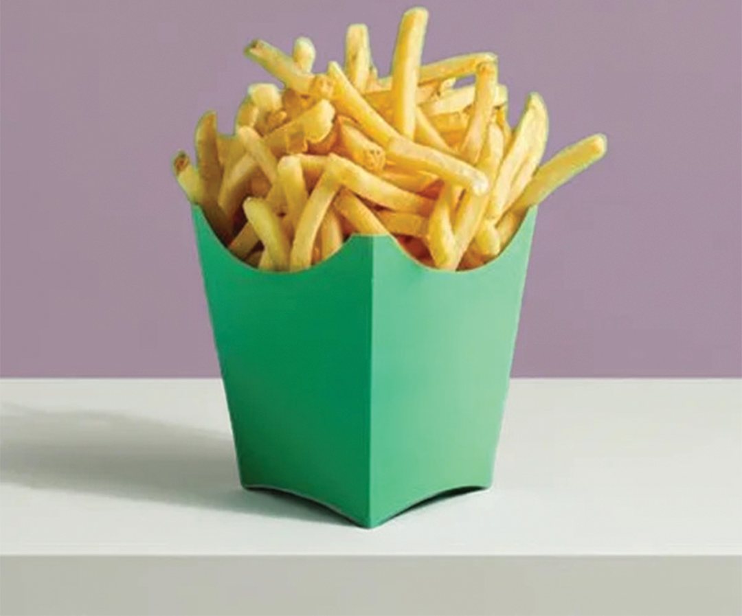 Green printed fry carton holding a full portion of fries