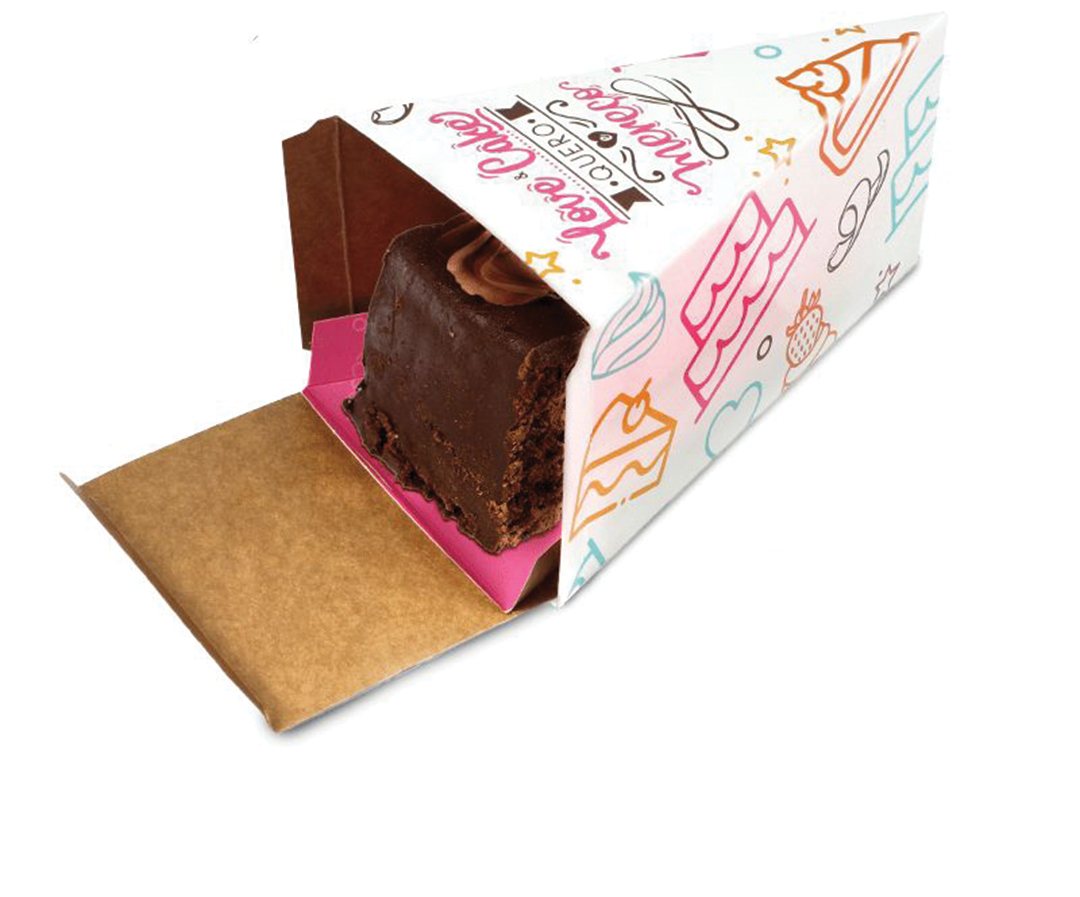 Printed pastry sleeve opened to reveal a slice of layered cake