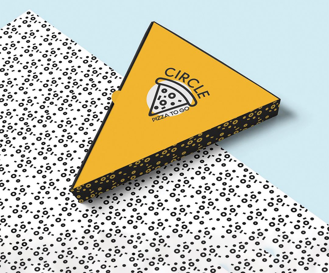 Yellow printed pizza wedge holder photographed on a patterned surface