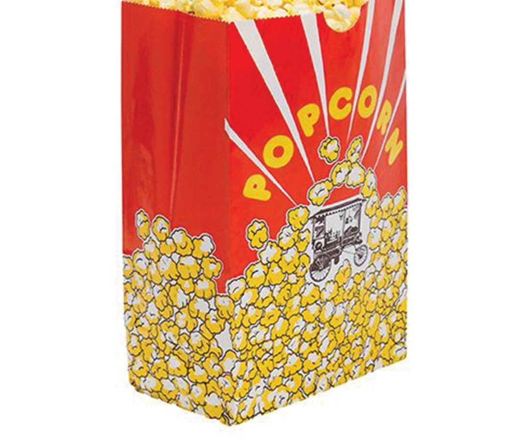 Red and yellow printed popcorn bag standing upright and full