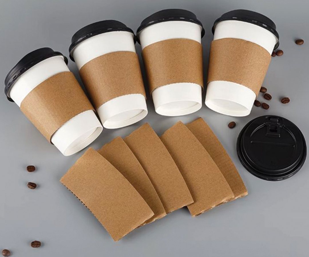 Group of hot cups with kraft sleeves and matching lids