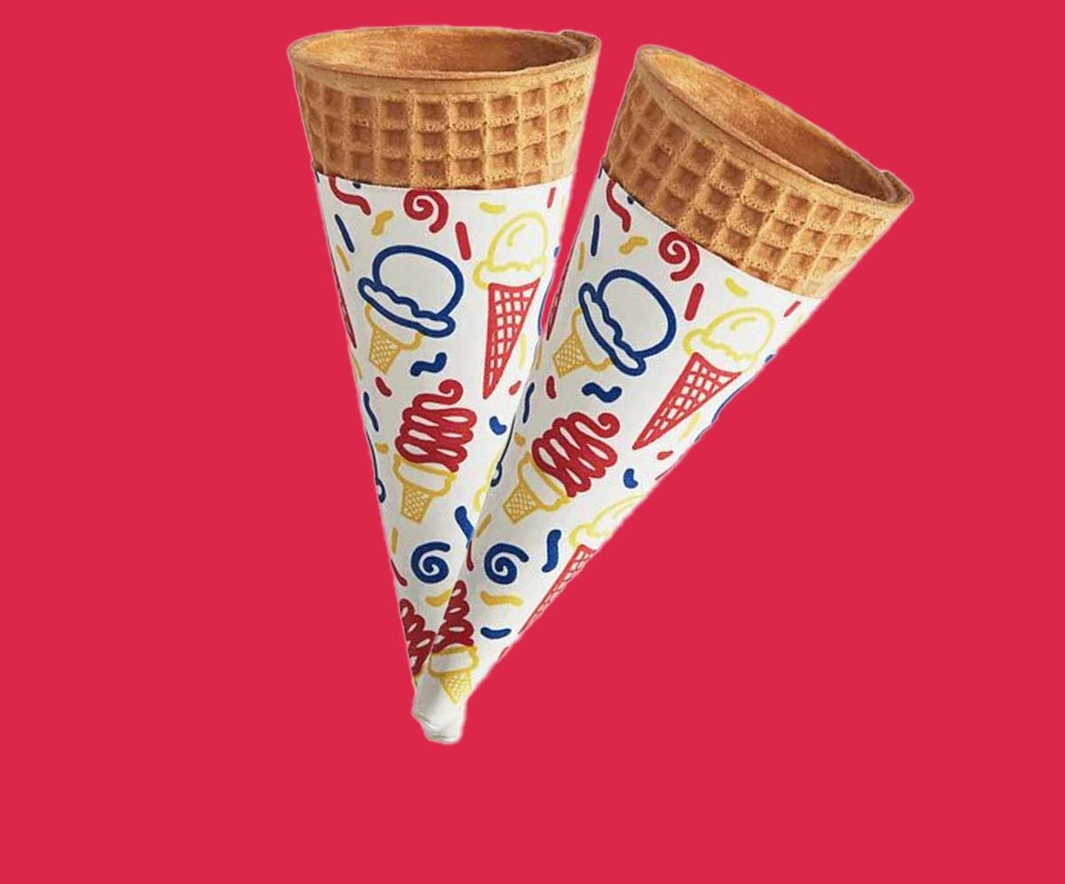 Two rolled cone sleeves printed with hand-drawn dessert doodles
