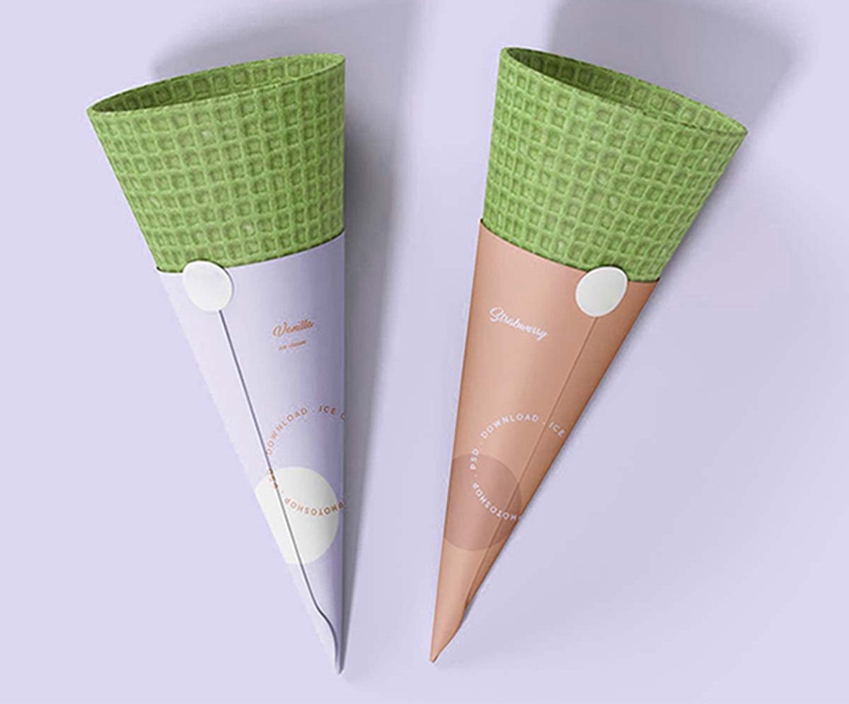 Green and tan rolled cone sleeves standing on a lilac backdrop