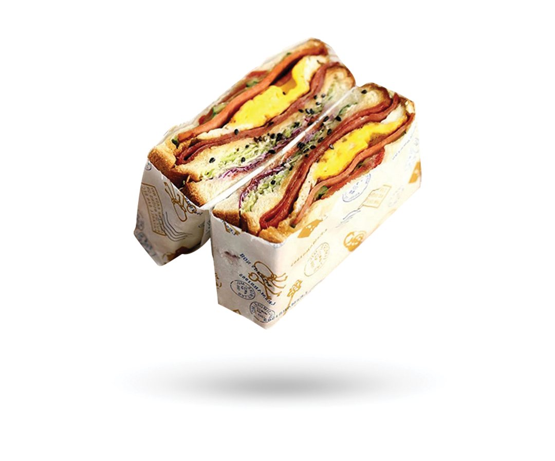 Club sandwich halves held together by a printed board sleeve