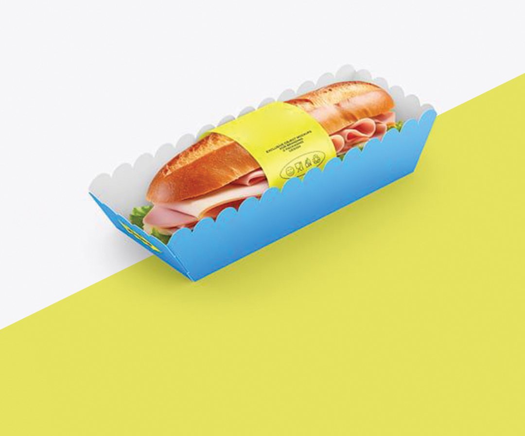 Blue and yellow board tray holding a filled sub roll