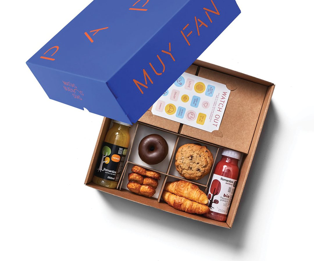Printed kraft snack box holding an assortment of small bites