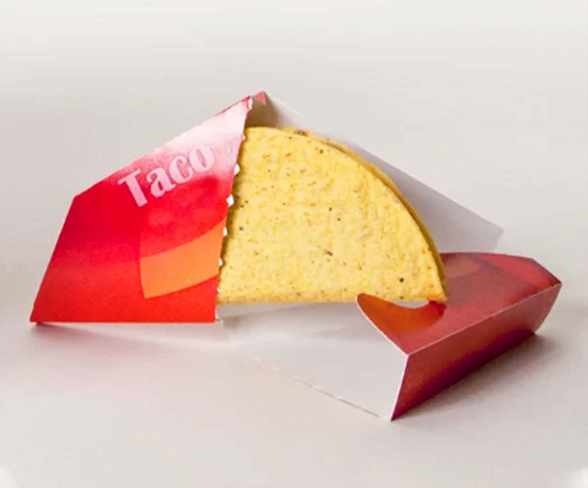 Red printed taco wrap opened to show a hard shell inside