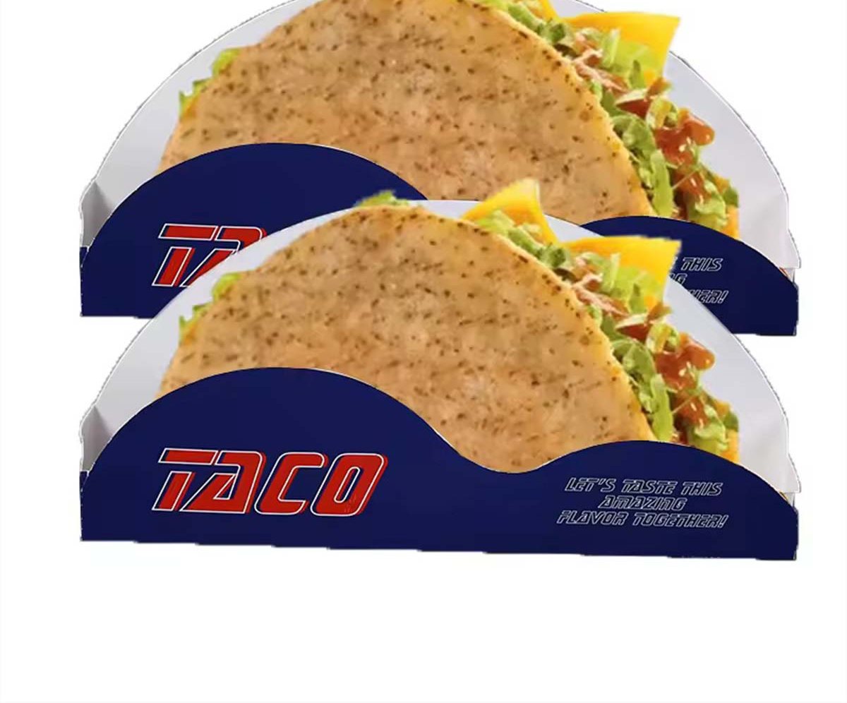 Two navy printed taco holders carrying filled soft tacos