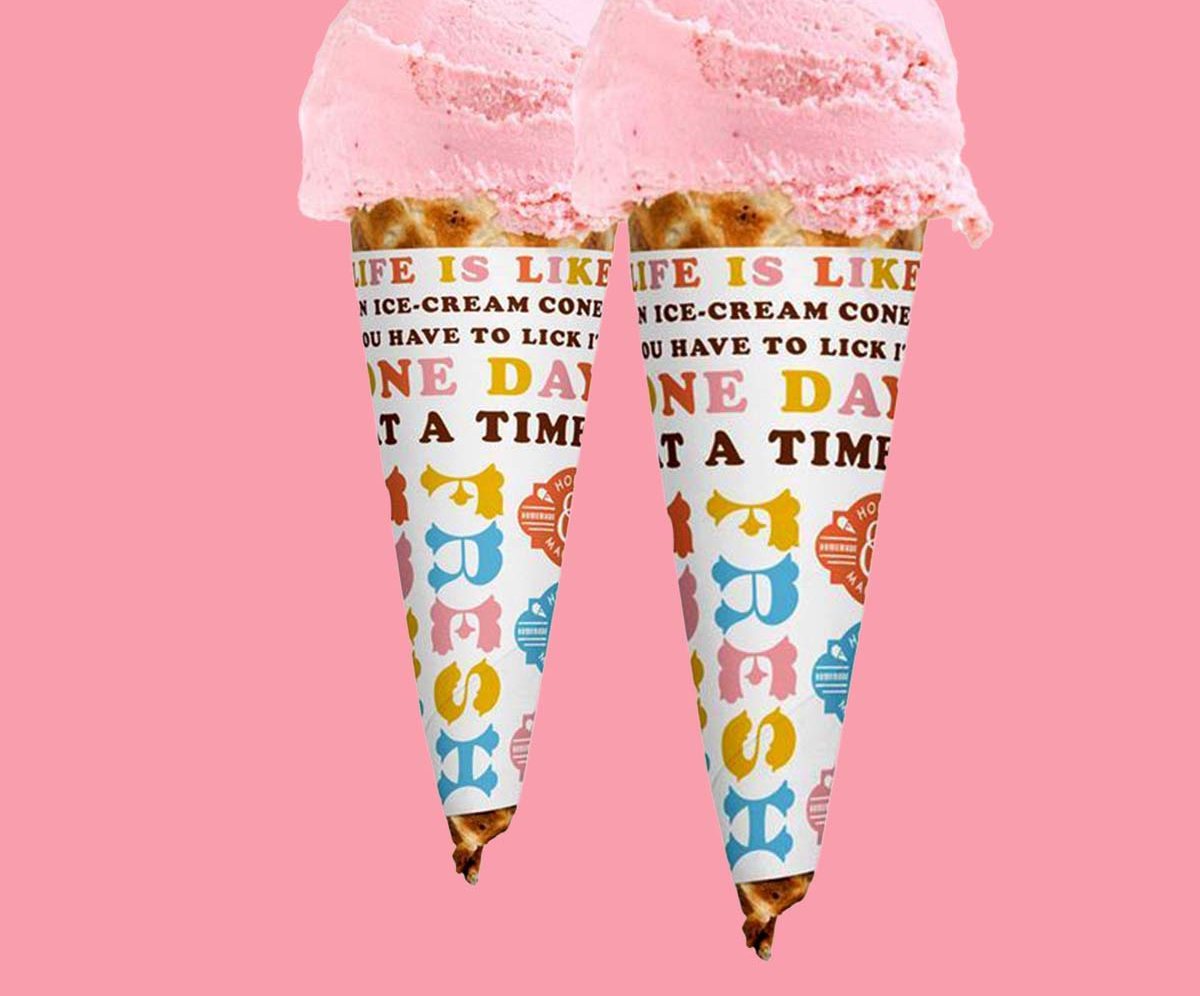 Two printed cone sleeves holding scoops of pink gelato