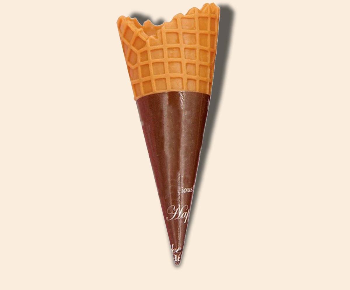 Waffle cone seated in a two-tone printed sleeve on a cream backdrop