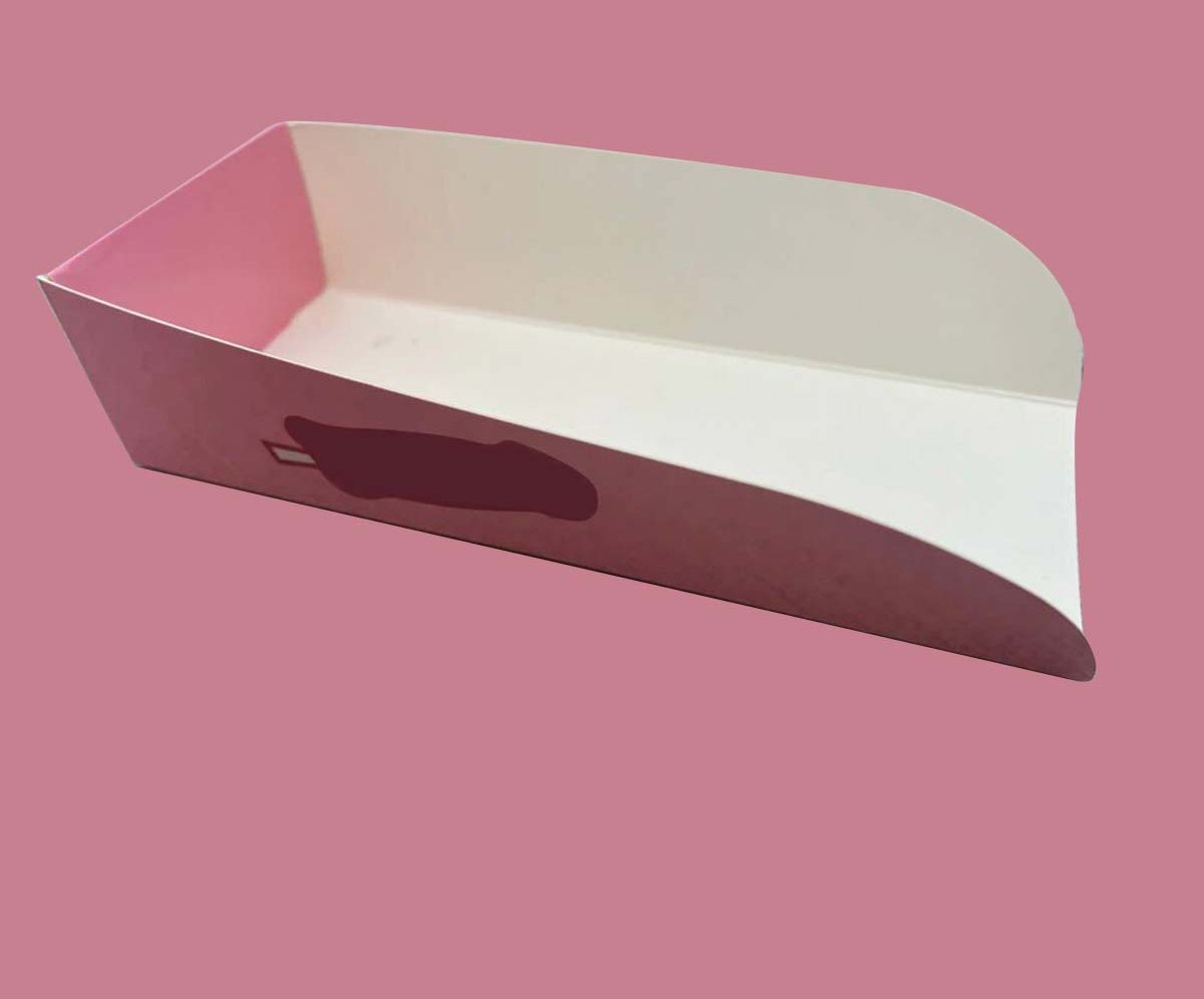 Pink and white board waffle tray photographed on a pink backdrop
