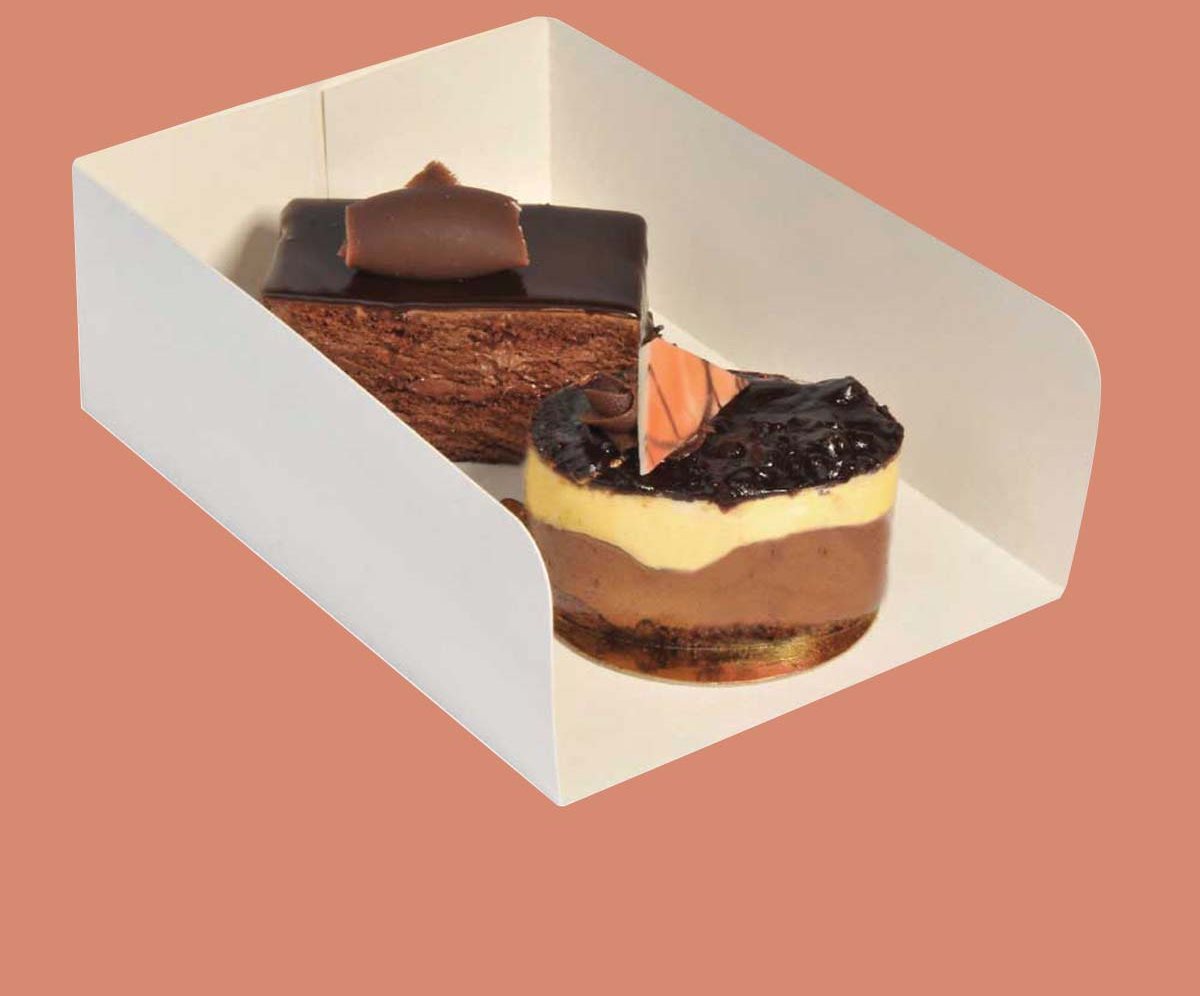 White dessert tray holding a chocolate slice and a layered cheesecake