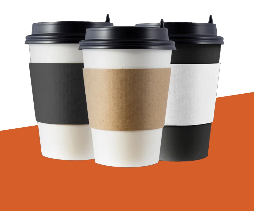 Three cups wearing kraft and black sleeves on an orange backdrop