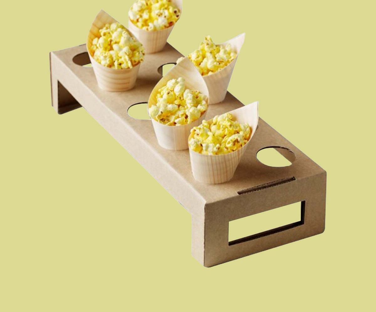 Mini cone carrier with a handle holding popcorn filled cones
