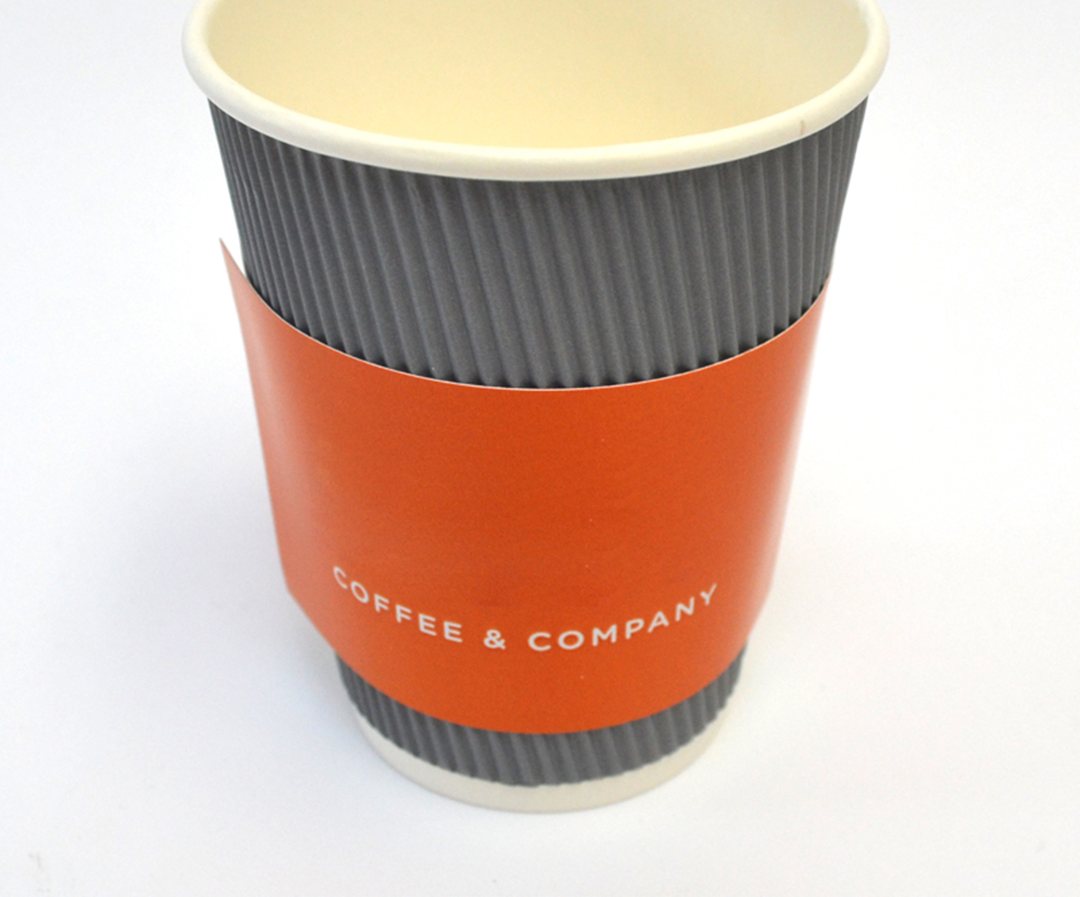 Orange ripple coffee sleeve printed with a cafe wordmark
